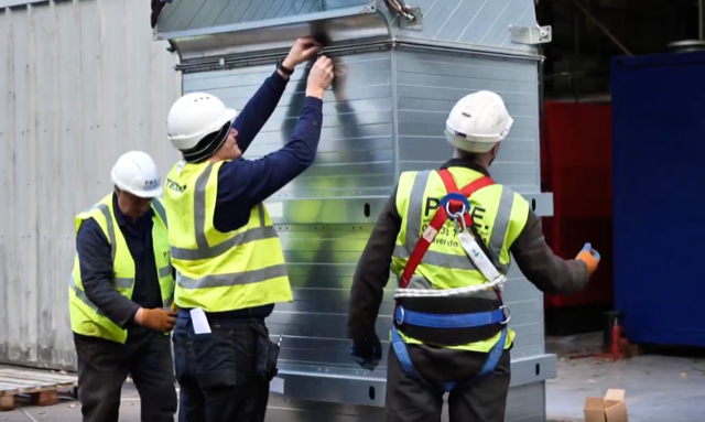 Workers assembling metal structure