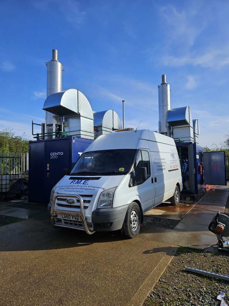 White van near industrial equipment